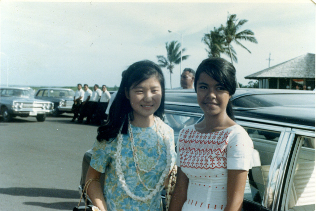 Posing with a friend during a trip to Samoa